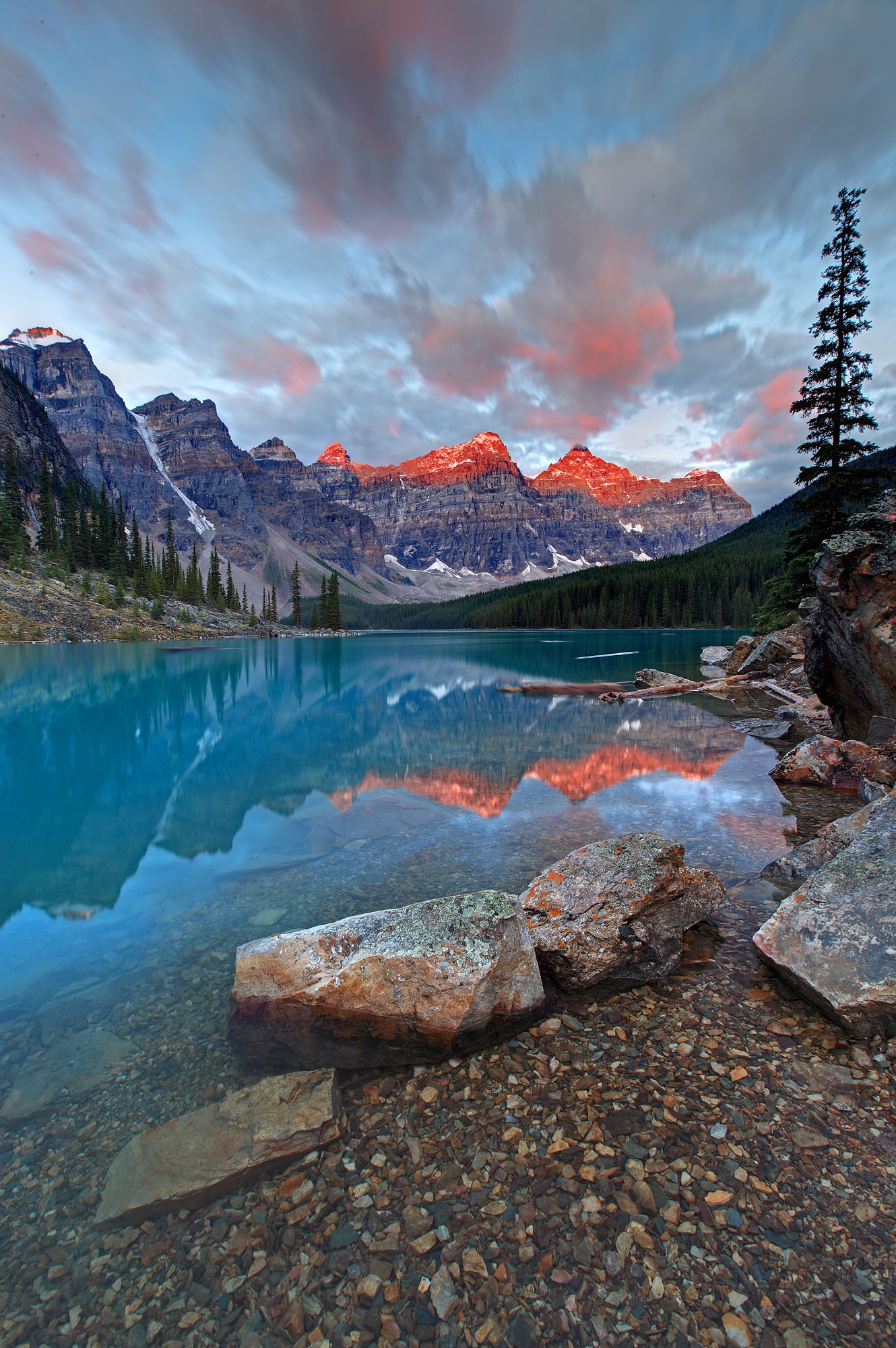 Alpenglow sunrise at Moraine Lake in the Valley of the Ten Peaks in the Canadian Rocky Mountains near Banff