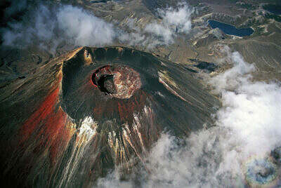 Aerial view of the Mount Ngauruhoe volcanic crater in New Zealand with its colorful lava, ash and pumice.