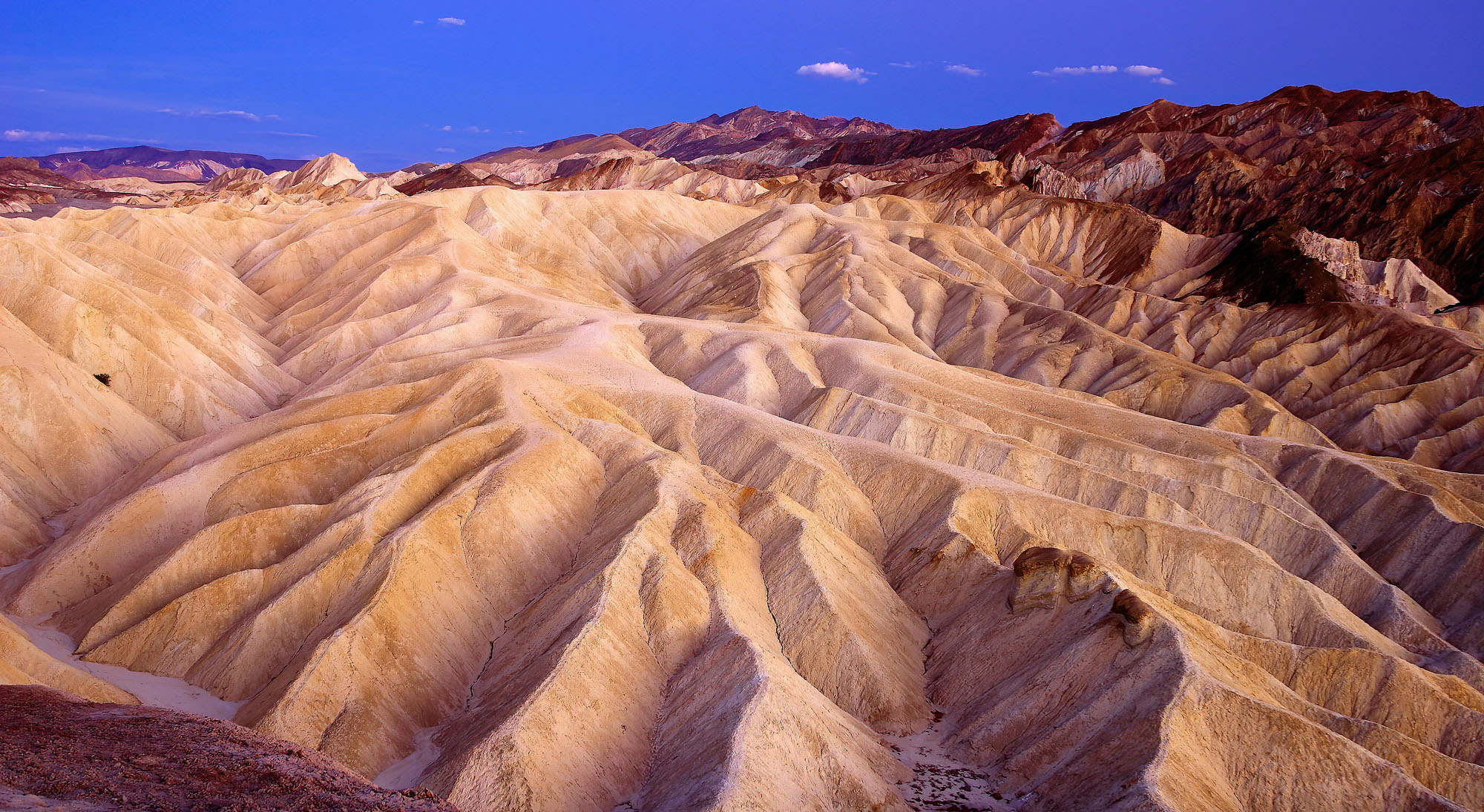 Zabriskie Point badlands in Death Valley with the sediments of Furnace Creek Lake at dawn